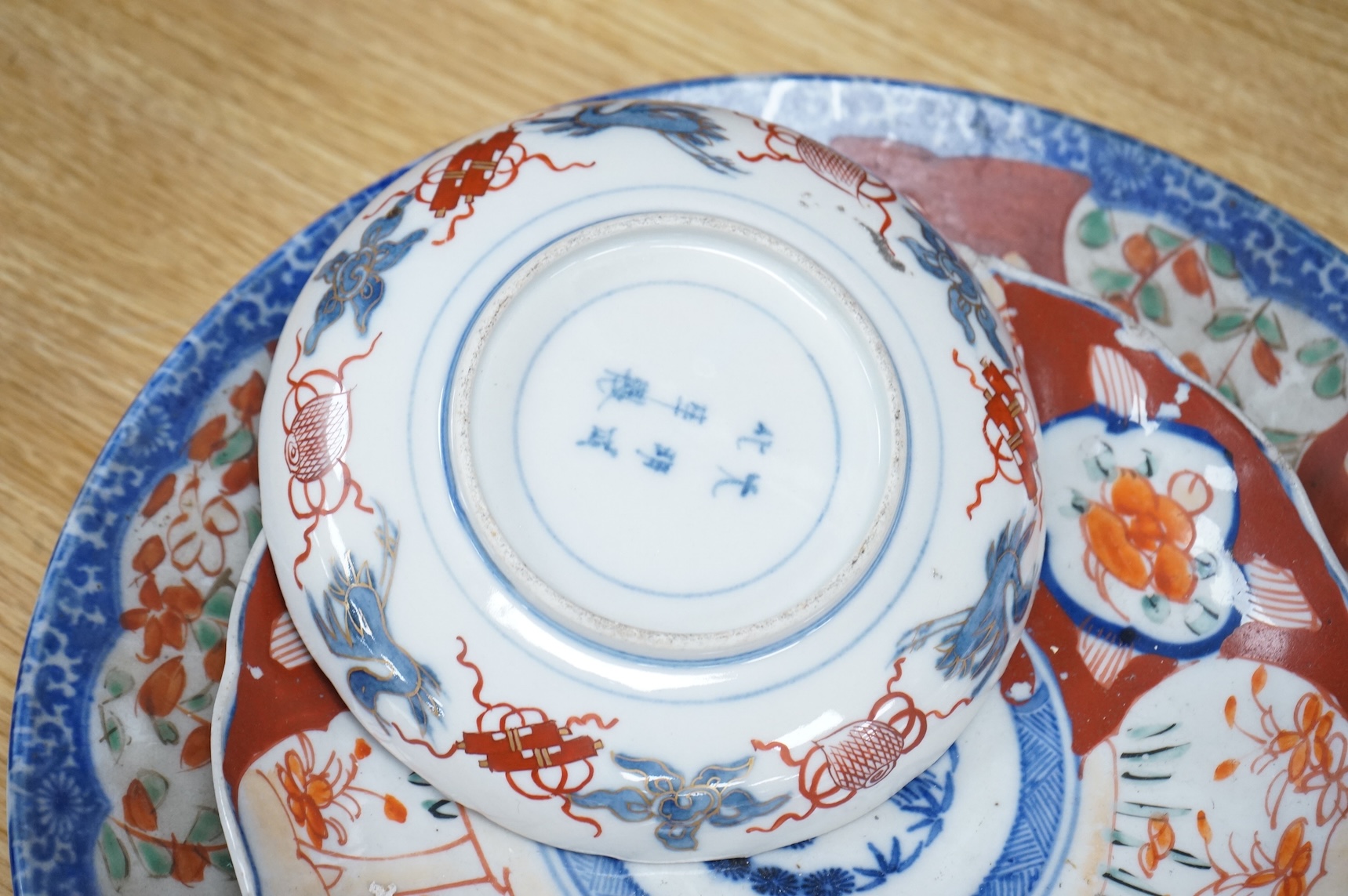 Three Japanese Imari dishes, largest 30.5cm